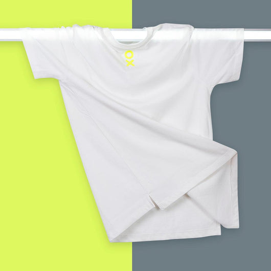 This Short Sleeve Unisex T-shirt is designed with a high straight front, low straight back, and side slit for a sleek modern style.