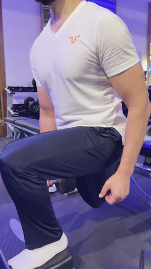 The neon orange logo adds a bold touch, while the slim-fit cut with a V neck and thin bottom style ensures a sleek and contemporary appearance.